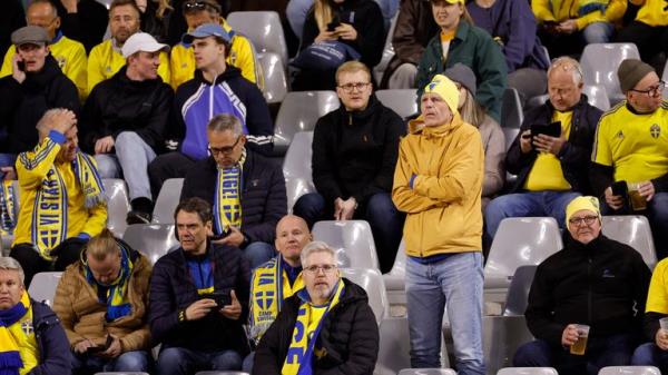 Sweden supporters react on stands during the Euro 2024 group F qualifying soccer match between Belgium and Sweden at the King Baudouin Stadium in Brussels, Monday, Oct. 16, 2023. Two Swedes were killed in a shooting late Mo<em></em>nday in central Brussels, police said, prom<em></em>pting Belgium&#39;s prime minister and senior Cabinet minister to hunker down at their crisis center for an emergency meeting. (AP Photo/Geert Vanden Wijngaert)