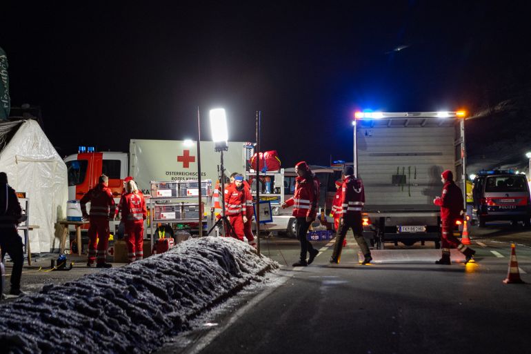 Rescuers works at the ski resort of Lech Zurs after an avalanche hit the area.