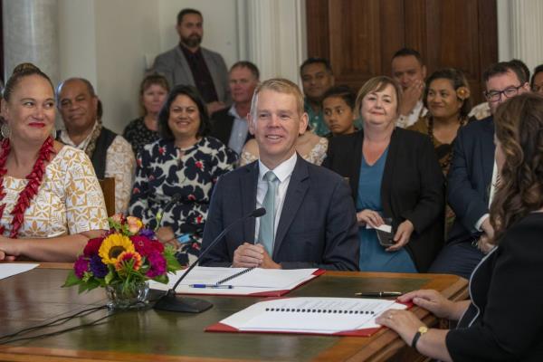 Chris Hipkins, center, is sworn in as New Zealand's next prime minister and Carmel Sepuloni, left, as deputy prime minister by Governor-General Dame Cindy Kiro, right, at Government House in Wellington, Wednesday, Jan. 25, 2023. 