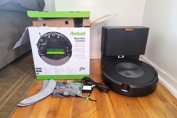 Roomba j7+ Combo Mop and Robot Vacuum charging next to product brand box